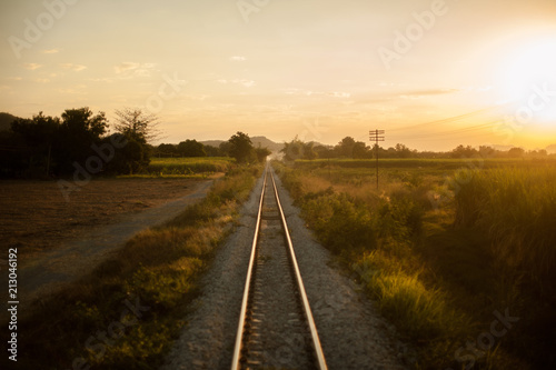 train tracks at sunset in thailand.