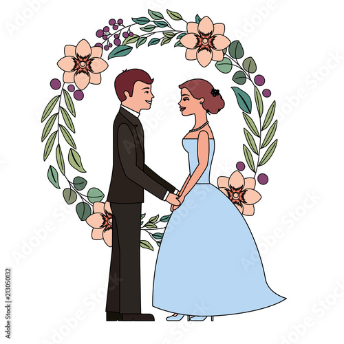 bride and groom holding hands in wreath flowers