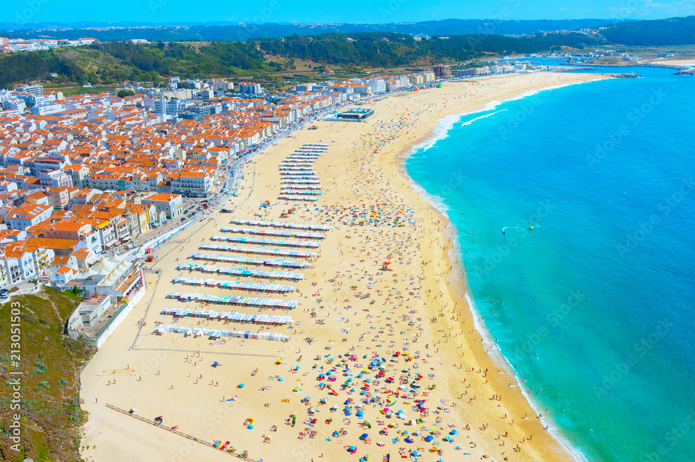People ocean beach Nazare Portugal