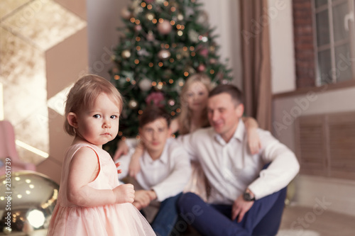 Portrait of beautiful happy family  merry father  daughter and son are sin Christmas decorations 