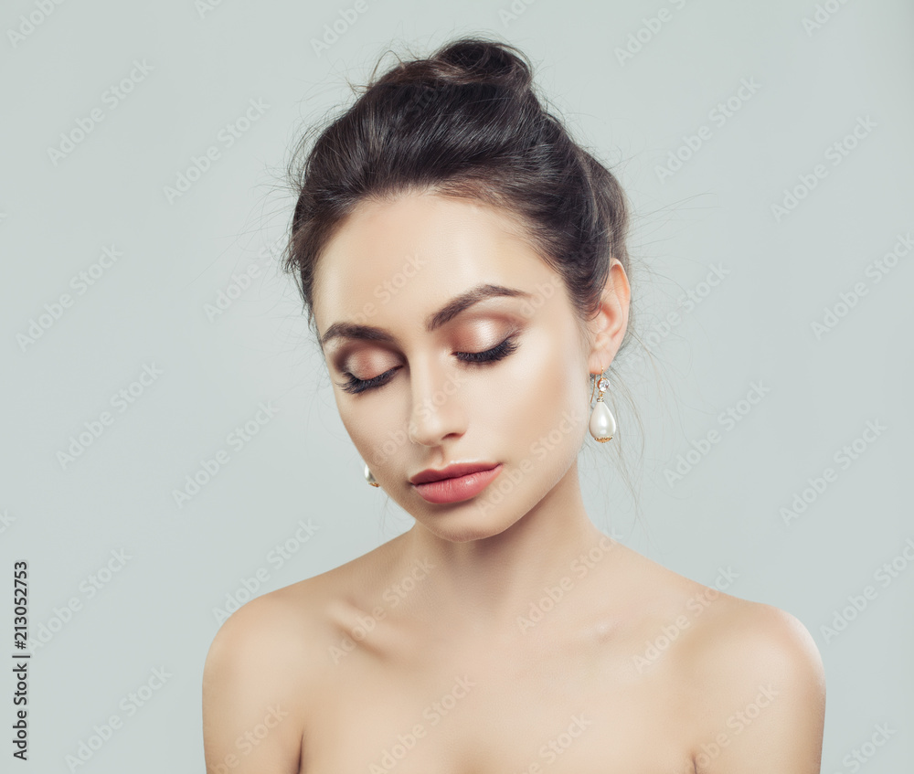 Young Cute Woman with Perfect Makeup and White Pearls Earrings Young Cute Woman with Perfect Makeup and White Pearls Earrings