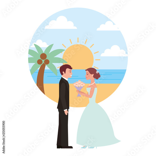 married couple in beach with bouquet of flowers