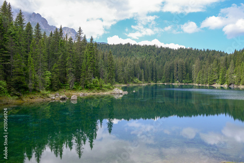 Fototapeta Naklejka Na Ścianę i Meble -  Lake Carezza with reflection of mountains in the Dolomites