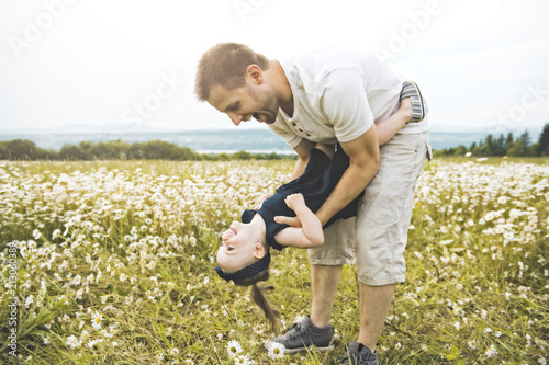 Father spending time with daughter during the sunset.