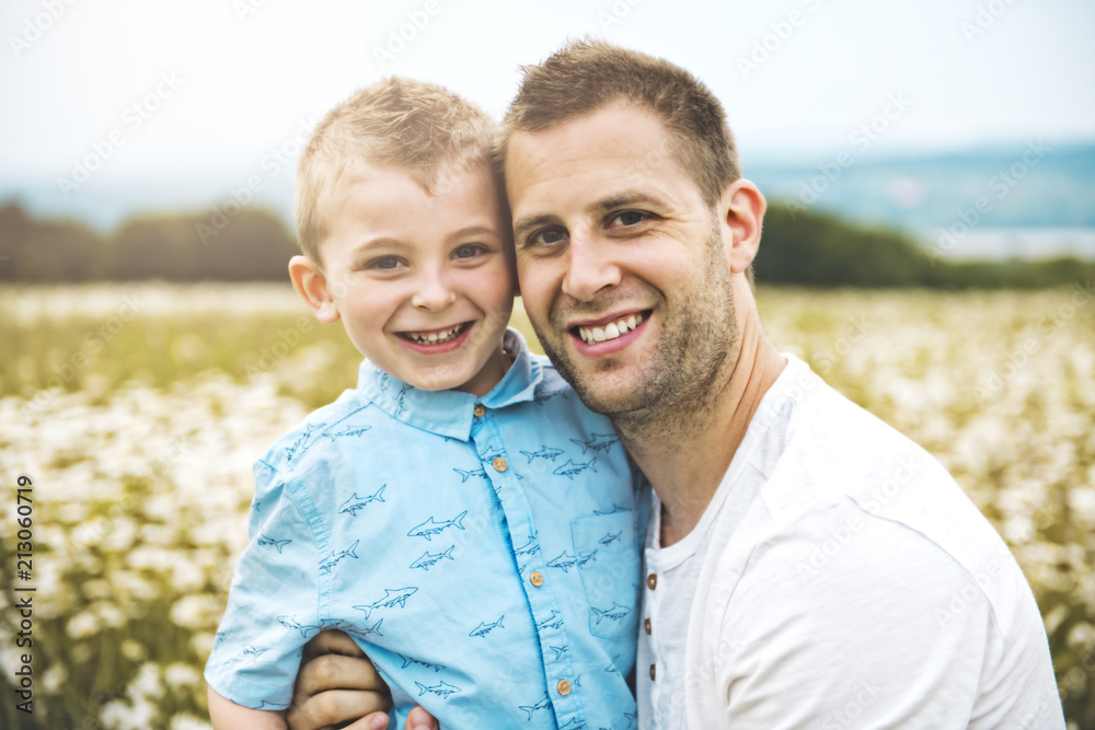 Fototapeta premium Father spending time with son during the sunset.