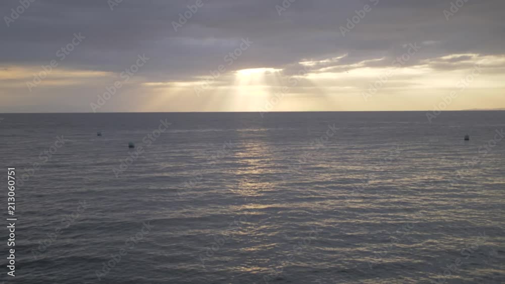 Dramatic sunrays coming through the clouds Dramatic sunrays coming through the clouds
