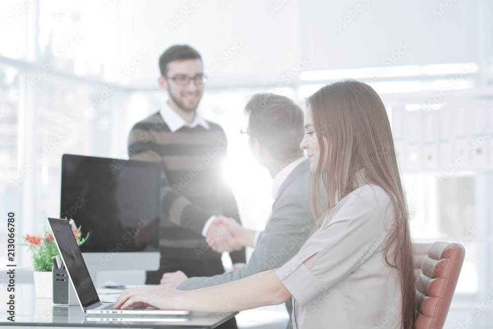 Manager and the client shake hands when meeting in the office Manager and the client shake hands when meeting in the office