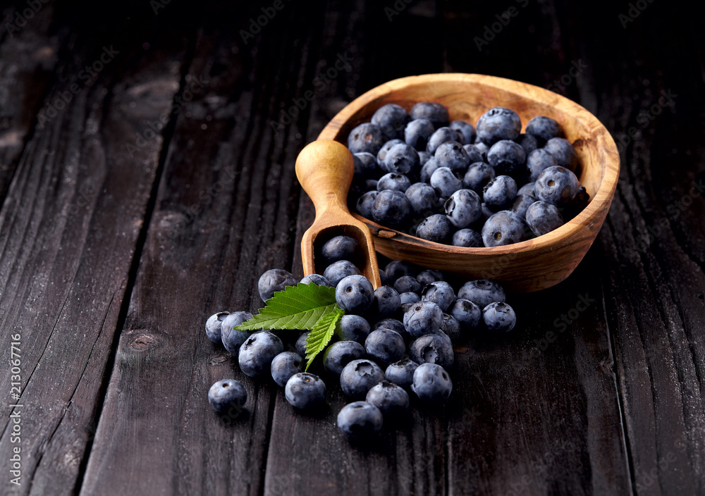 blueberries on black wooden background blueberries on black wooden background