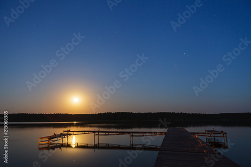 Evening landscape of moon rise over calm lake © lukszczepanski