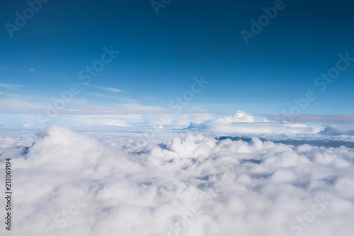 cloud and blue sky view from window of airplane