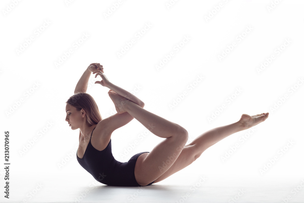 Young beautiful athlete is posing in studio Young beautiful athlete is posing in studio