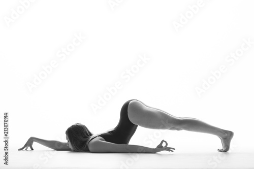 Young beautiful athlete is posing in studio