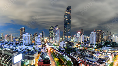 Bangkok Nightscape Business District Panorama View with Height Building and Storm Cloudy in Night Time