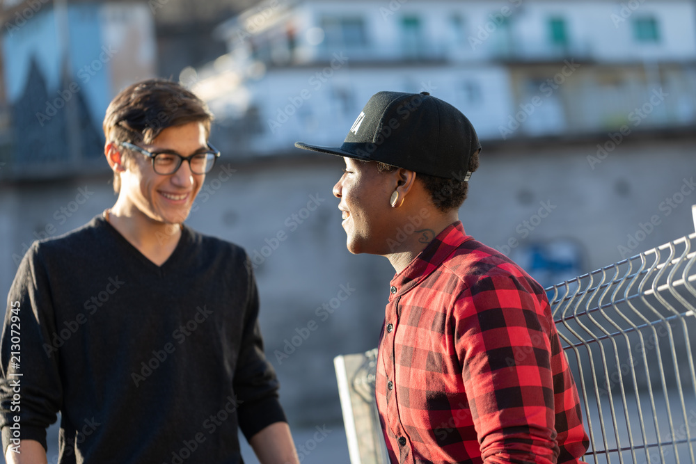 black friend talking to white friend ni the street black friend talking to white friend ni the street