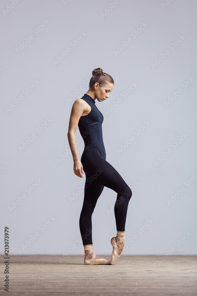 Young beautiful ballerina is posing in studio Young beautiful ballerina is posing in studio