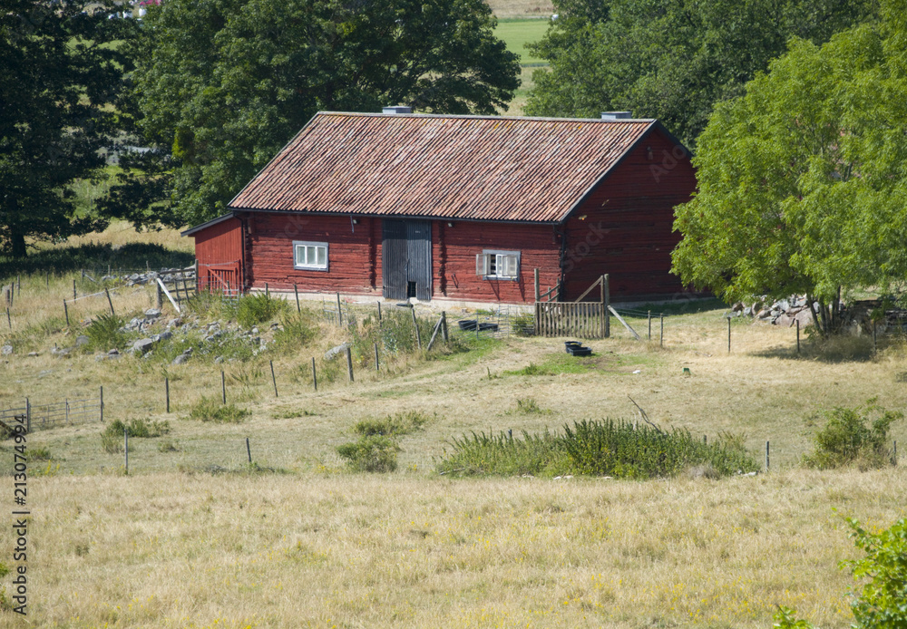 Old swedish timber house at Adelsö church in Ekerö, Stockholm Old swedish timber house at Adelsö church in Ekerö, Stockholm