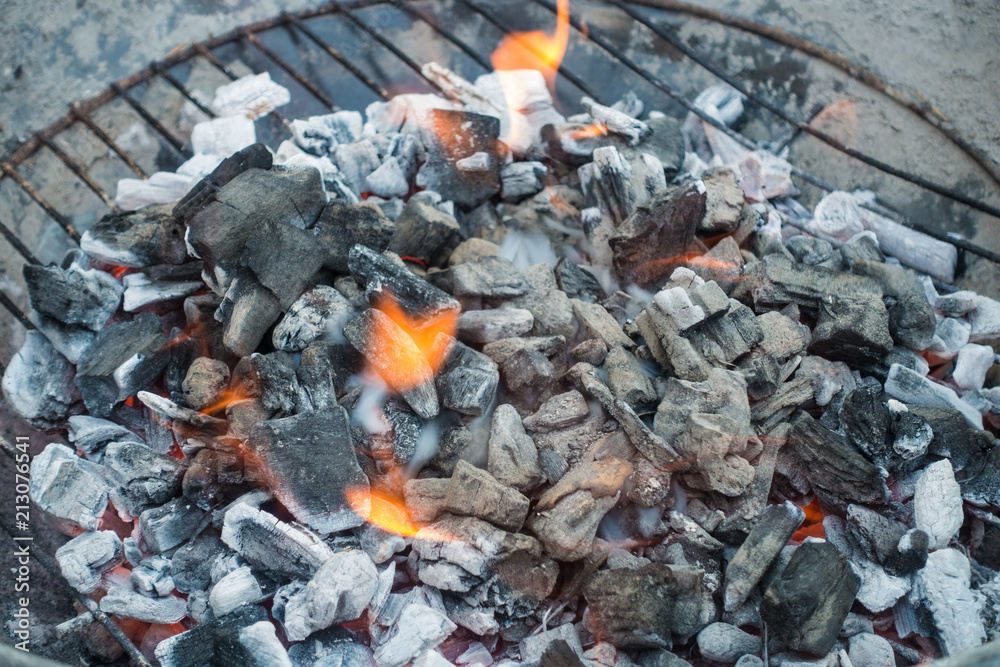 Charcoal burning in a barbeque ready to cook. Charcoal burning in a barbeque ready to cook.