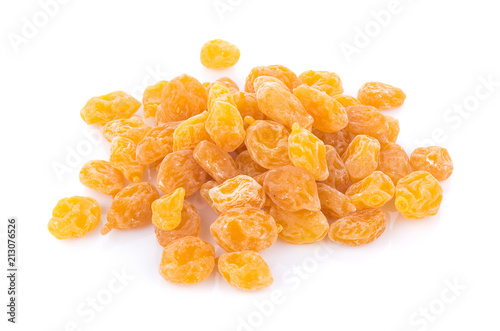 Dry yellow plums on white background. top view