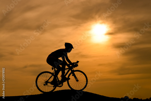 Fototapeta Naklejka Na Ścianę i Meble -  Men, bicycle, silhouette, sunset
