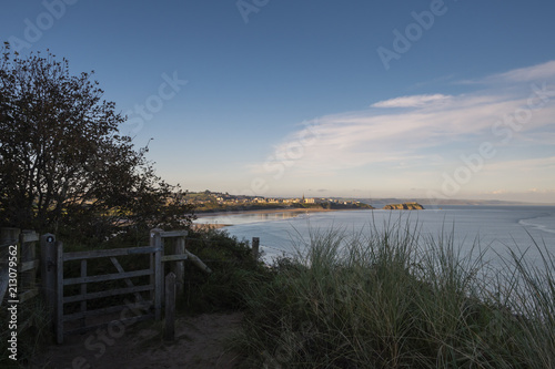 A view looking across South Beach Tenby to Tenby Pembrokeshire Wales from the coast path