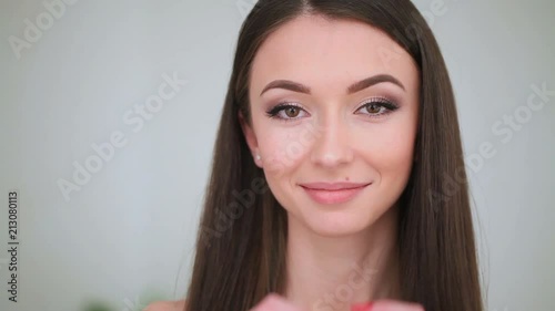 Beauty Face Care. The Portrait of Young Woman With a Daily Makeup Closes and Opens Her Eyes