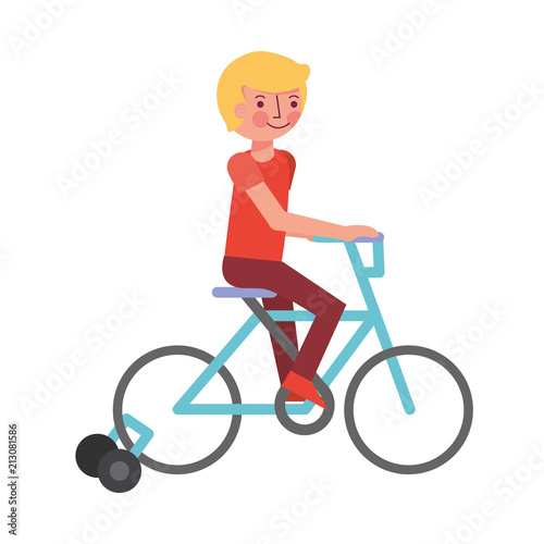 little boy in bicycle with auxiliary rims