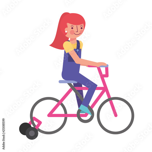 Fototapeta Naklejka Na Ścianę i Meble -  little girl in bicycle with auxiliary rims