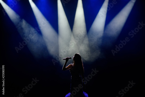 Singer in silhouette photo
