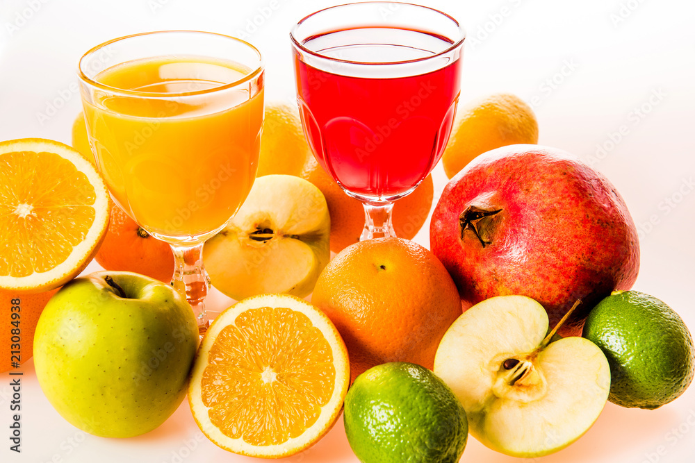 Ripe fruit and juice. Glasses of juice and fruits isolated on white. Ripe fruit and juice. Glasses of juice and fruits isolated on white.