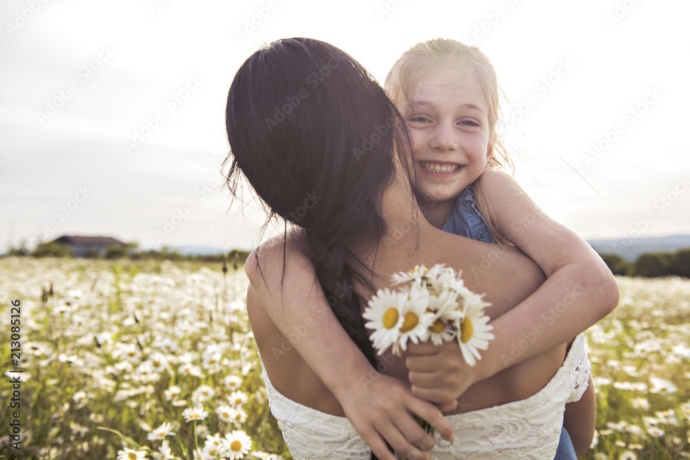 Mother spending time with daughter during the sunset. Mother spending time with daughter during the sunset.