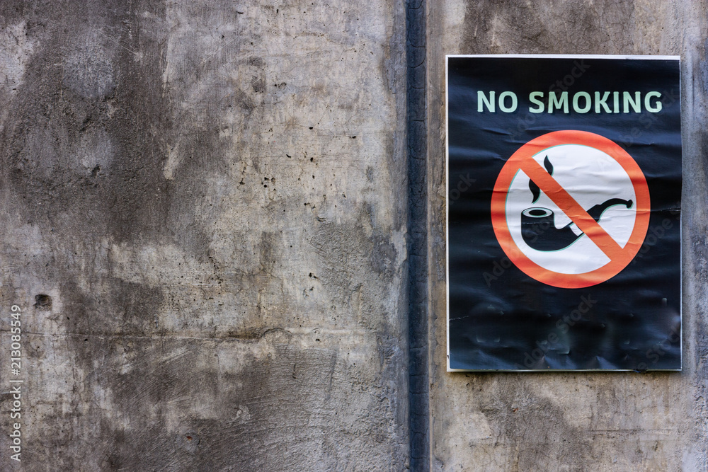 no smoking sign on cement texture background no smoking sign on cement texture background