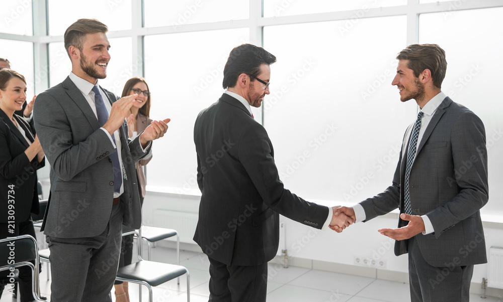 handshake after the completion of a new project plan handshake after the completion of a new project plan
