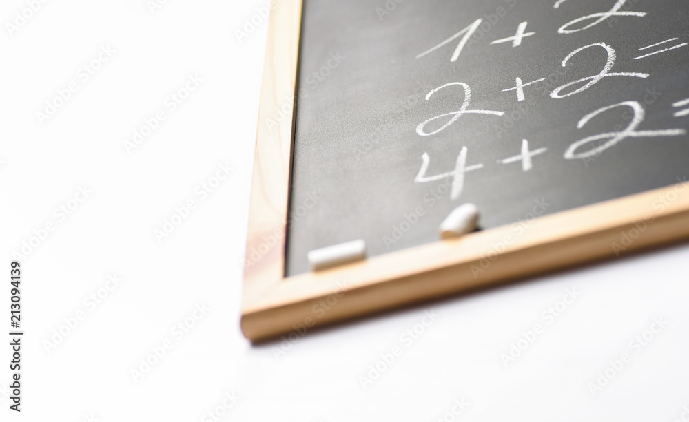 Blurred Fragment of Black Chalkboard with Hand Written Simple Mathematics Equations White Chalks. Back to School Concept Education Learning. Creative Image with Copy Space Blurred Fragment of Black Chalkboard with Hand Written Simple Mathematics Equations White Chalks. Back to School Concept Education Learning. Creative Image with Copy Space