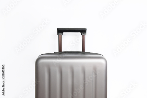 Suitcase on light grey background with place for text. Minimal creative travel concept