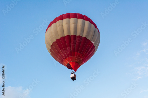 Hot air balloon under blue sky.