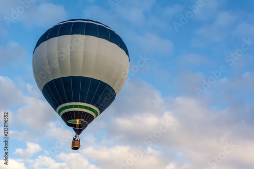 Hot air balloon under blue sky.