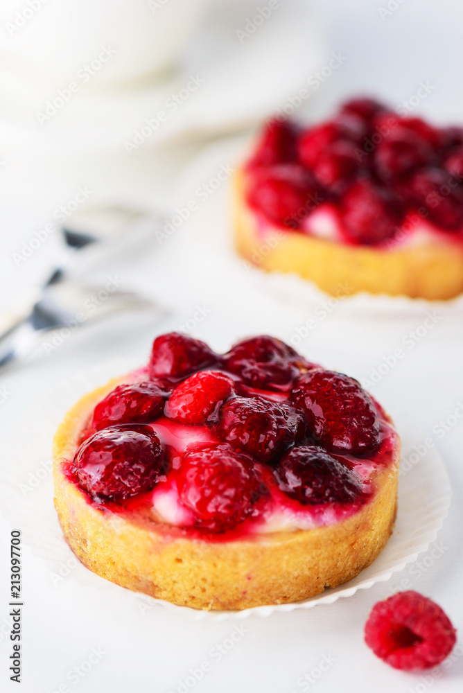 Tartlets with raspberries and a cup of tea Tartlets with raspberries and a cup of tea