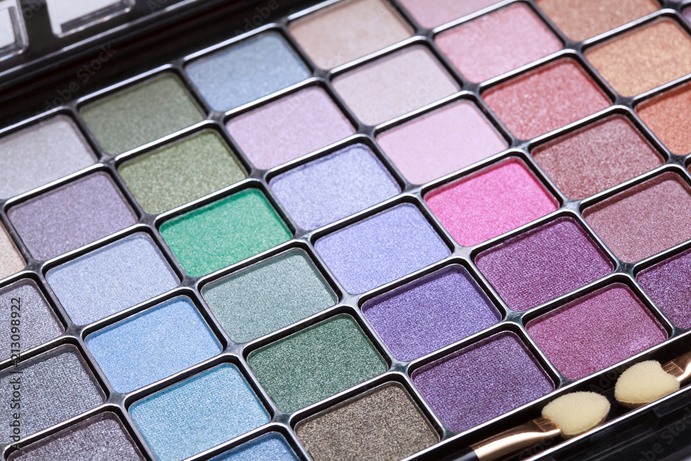 multicolored eye shadows palette on a white background multicolored eye shadows palette on a white background