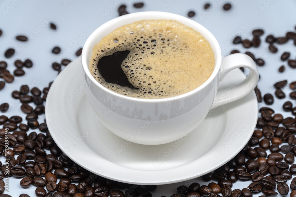 White cup of coffee on White background White cup of coffee on White background