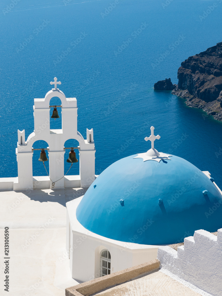 Blue dome and three bells of Fira
