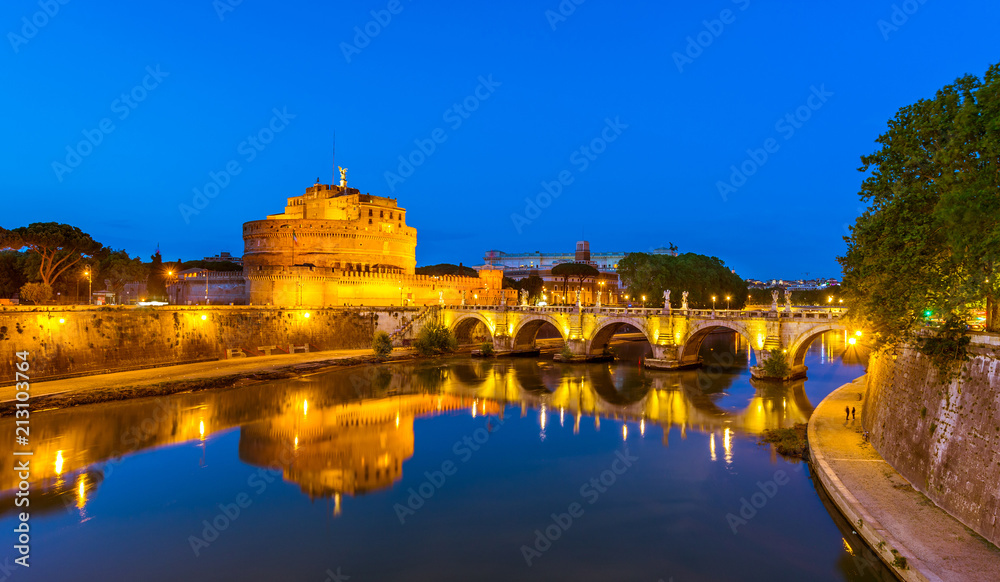 Night view of Castle Sant Angelo (Mausoleum of Hadrian), bridge Sant Angelo and river Tiber in Roma. Italy.