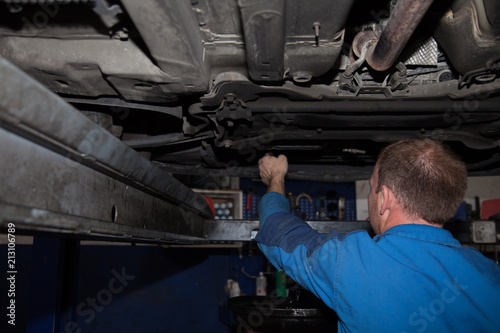 Repair service man car service worker repairing vehicle