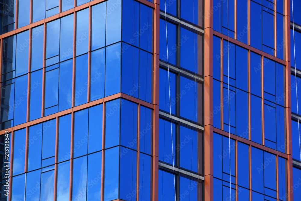 Fototapeta premium Blue Glass Windows reflect clouds