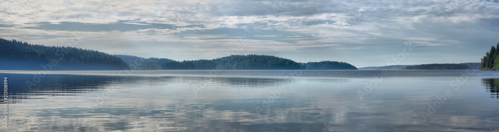 Panorama of the lake with fog at dawn