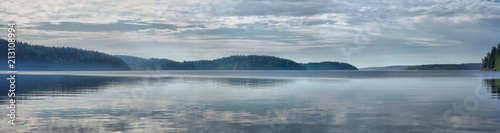 Panorama of the lake with fog at dawn
