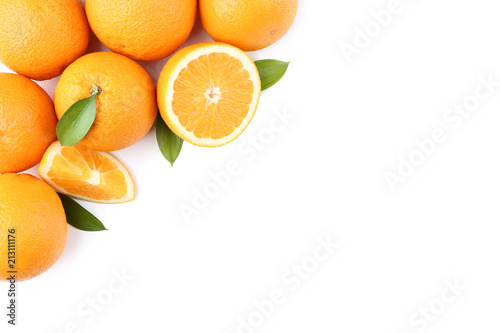 Orange fruit with green leafs on white background