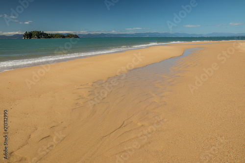 Coast of South Island, New Zealand. Just a perfect day, blue sky, crystal clear water, empty beaches. What else can one wish for?