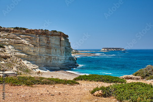 Cyprus. Peyia. The road to Avakas. Bay with a pebbly beach and the island of Kyonas photo