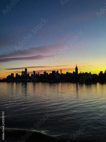 Silhouette of the Manhattan skyline in New York at dawn