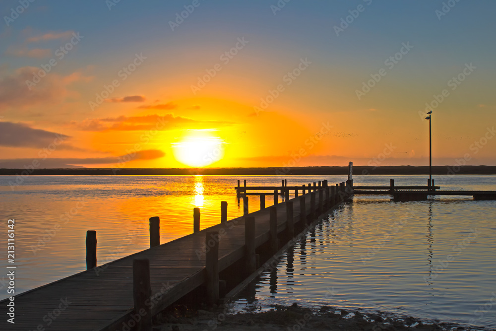River sunset over jetty